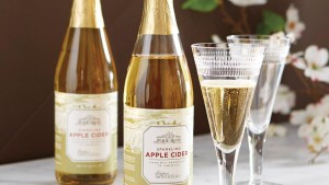 Two bottles of Monticello Sparkling Cider with white and light-green labels showing a drawing of Monticello and the words "Sparkling / Monticello Cider / Proudly Made in Americar"